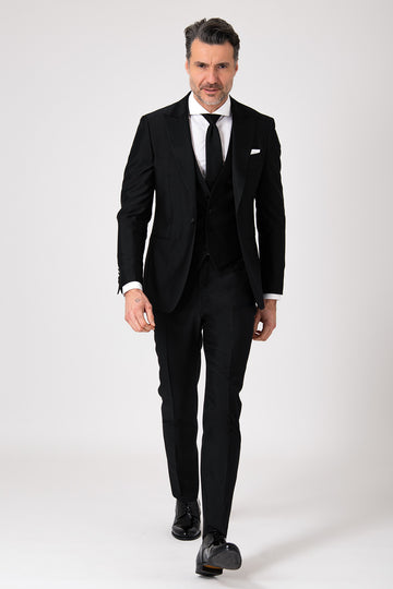 Black formal dress with a lance-shaped bodice