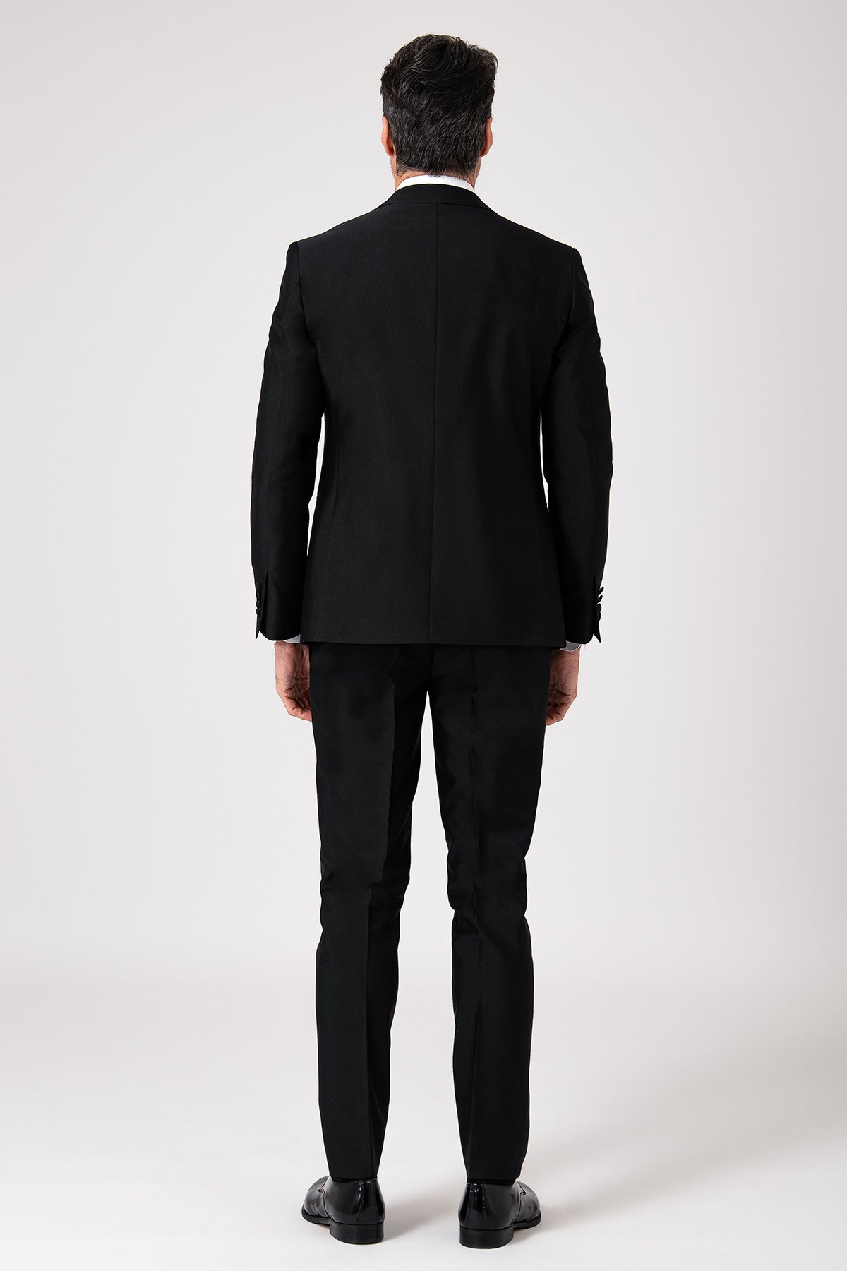 Black ceremonial dress with a lance-shaped bodice