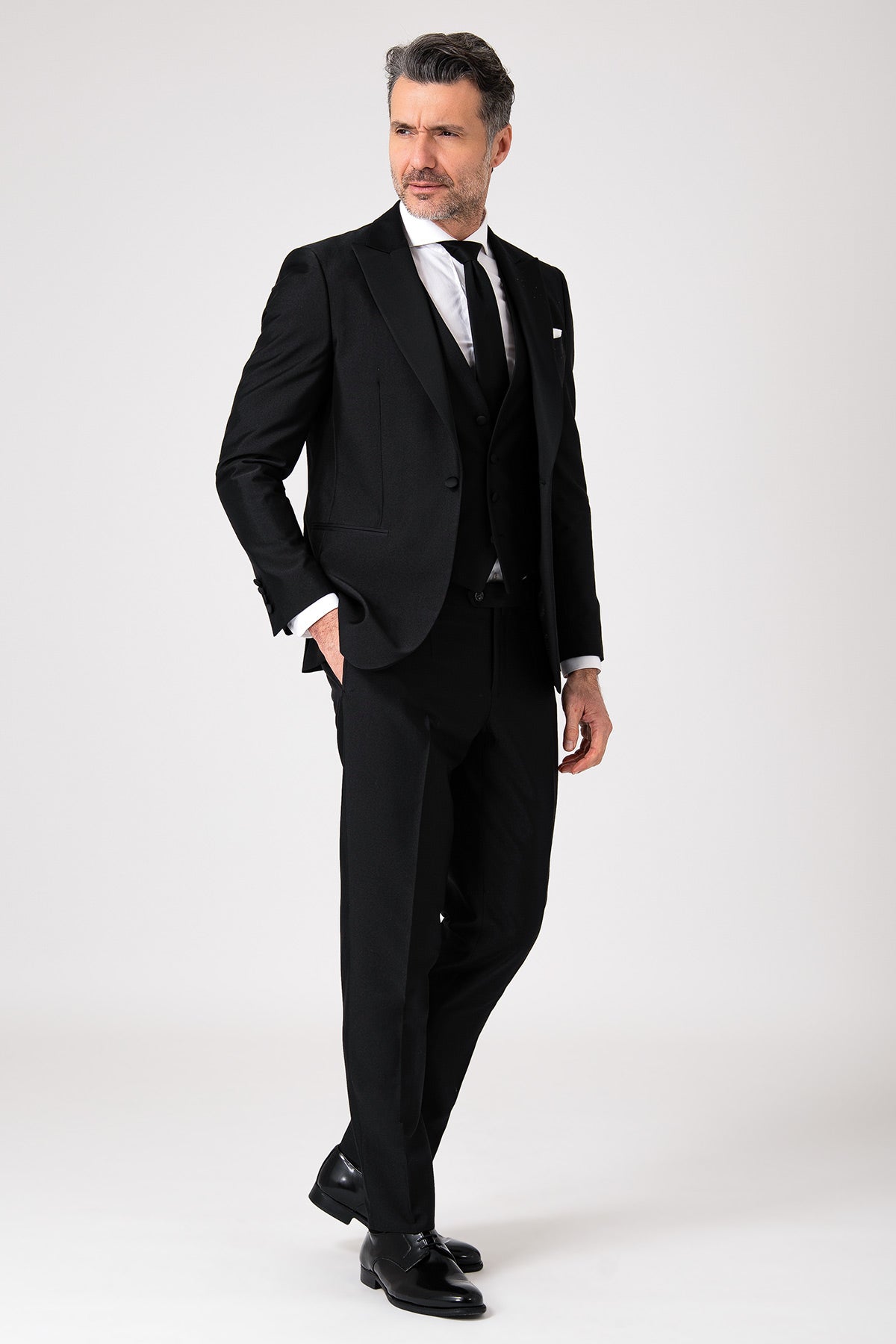 Black formal dress featuring a lance-shaped front design