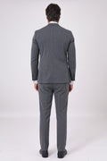Back view of the charcoal two-piece suit on a model