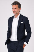 Navy blue suit with patch pocket jacket on a model, front view