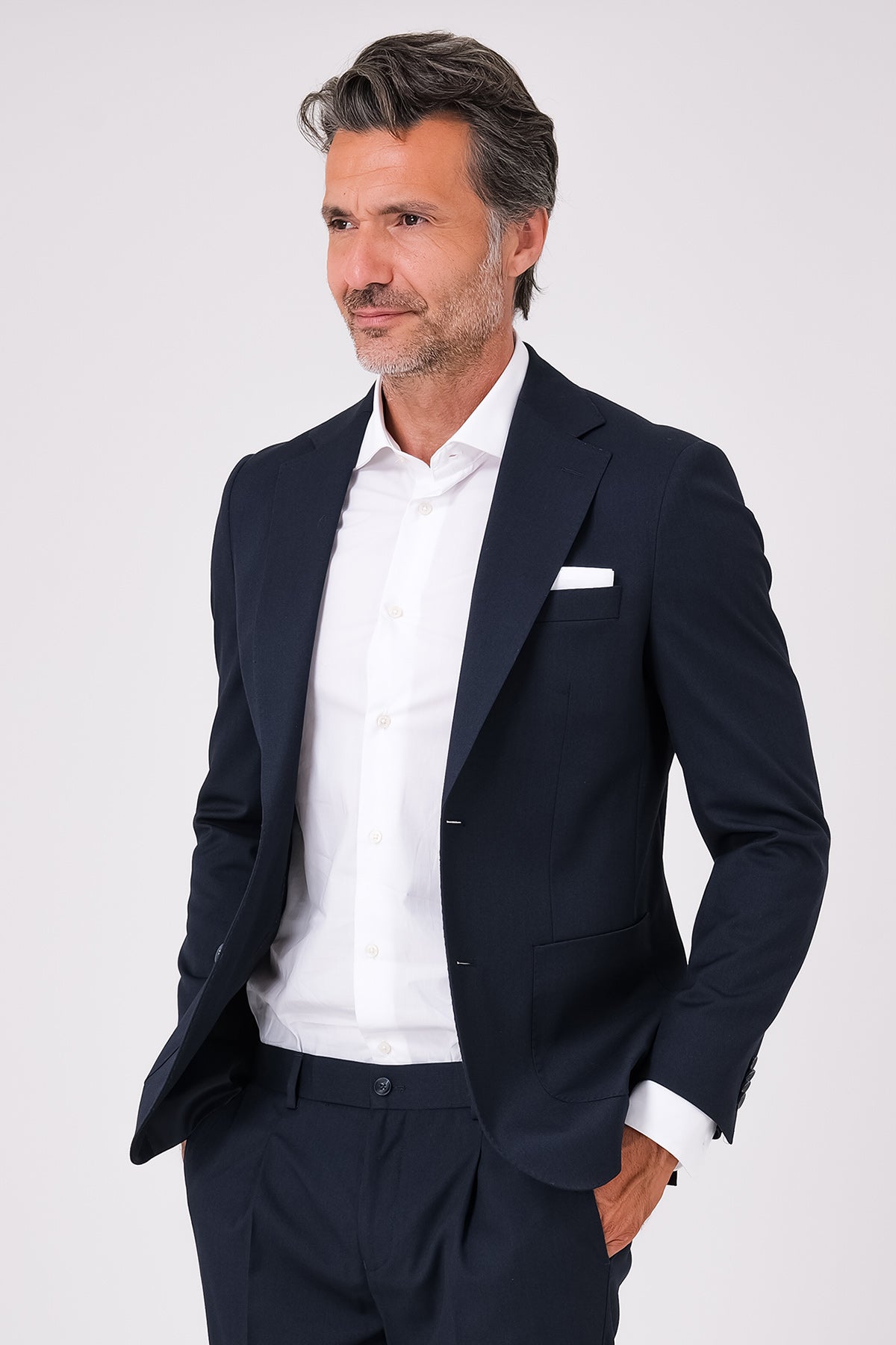 Navy blue suit with patch pocket jacket on a model, front view