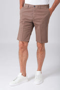 Basic stretch cotton bermuda shorts in mud color, shown from the front