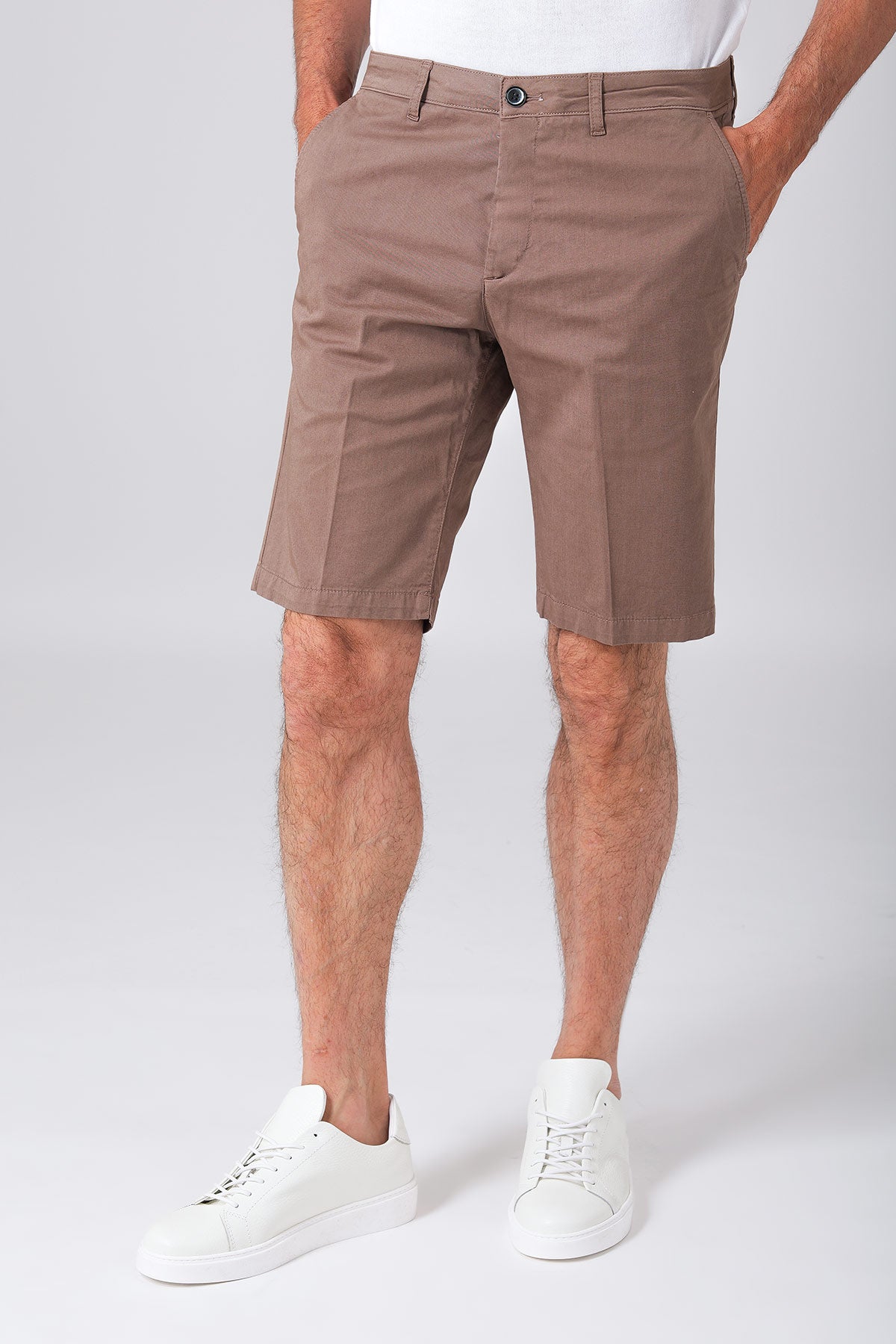 Basic stretch cotton bermuda shorts in mud color, shown from the front