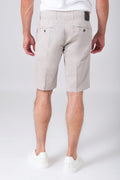 Basic stretch cotton Bermuda shorts in sand color, shown from the back