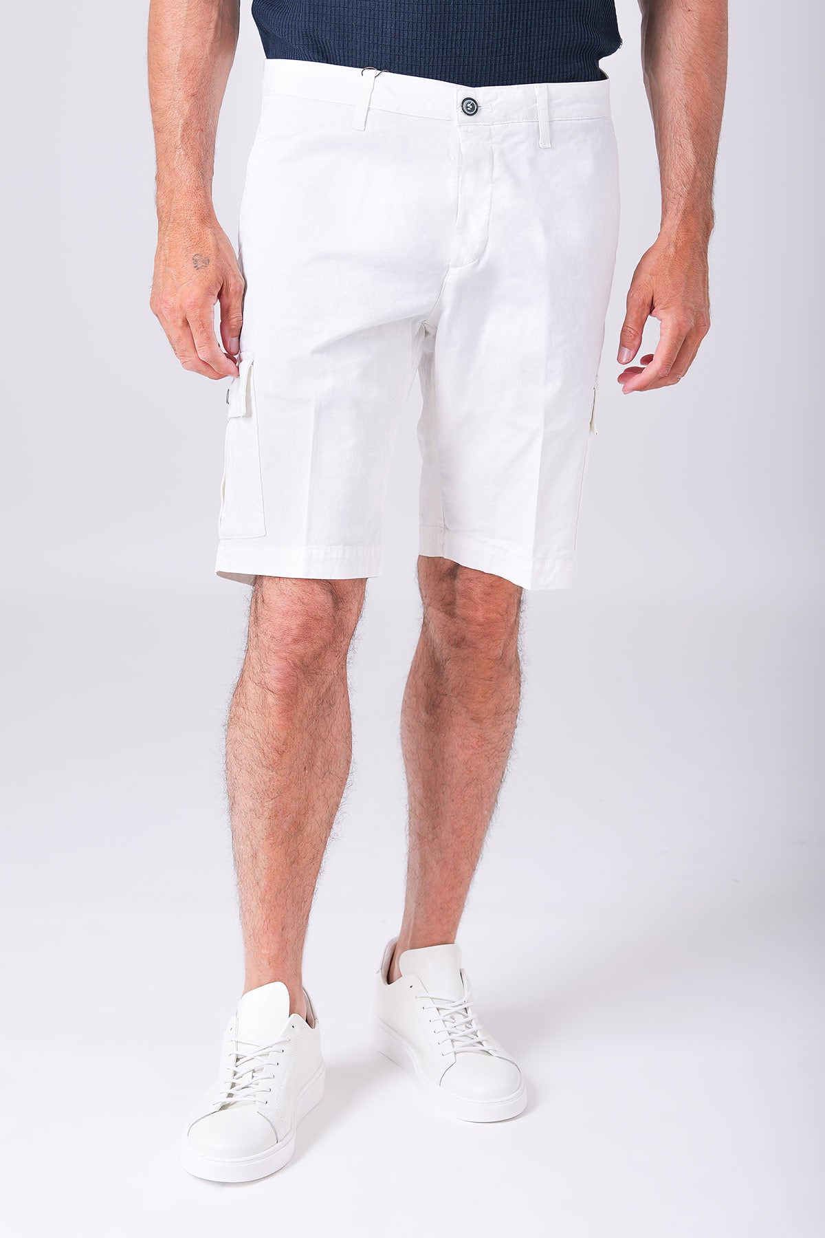 Front view of slightly stretchy cotton cargo shorts in cream