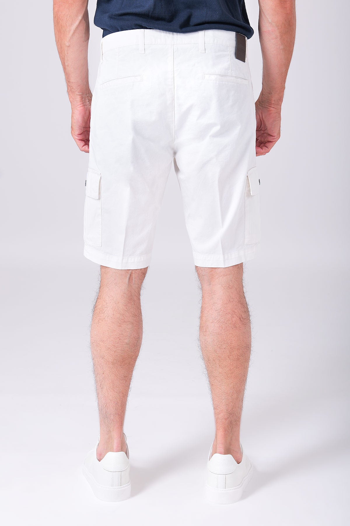 Lightly stretchy cotton cargo bermuda shorts in cream - back view