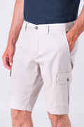 Cotton blend cargo shorts in sand with a close-up of the technical details