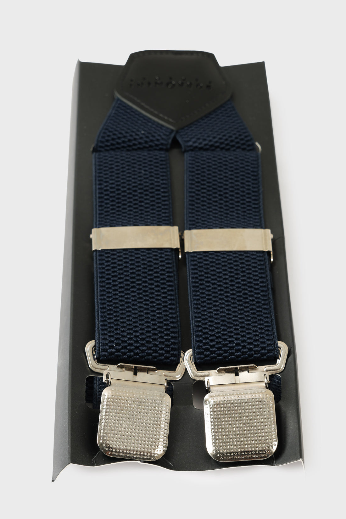 Front view of blue braces with raised geometric texture and metal clips