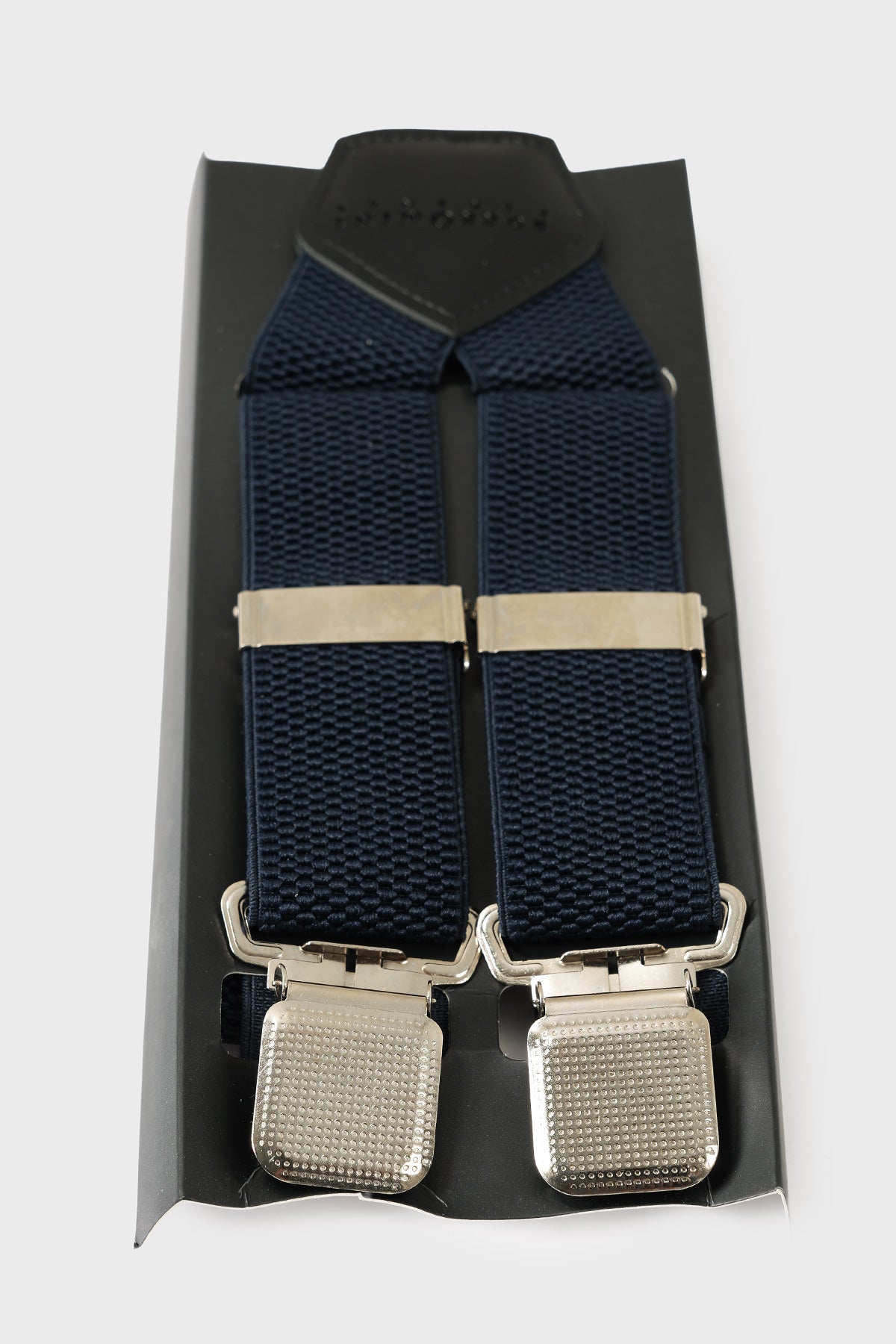 Front view of blue braces with raised geometric texture and metal clips