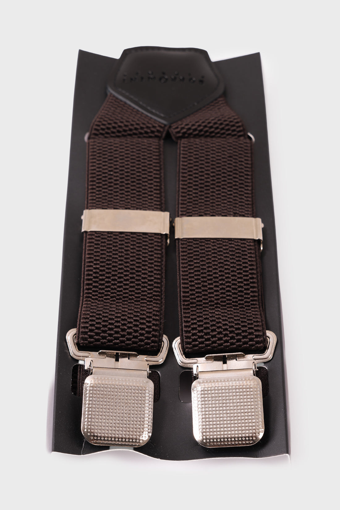 Front view of blue braces with raised geometric texture and metal clips