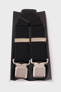 Black braces with raised geometric pattern and silver metal clips on a display stand