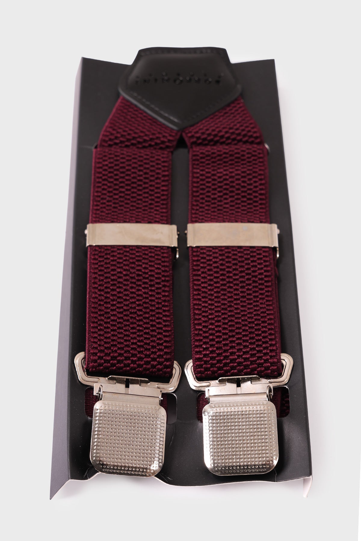 Red braces with embossed geometric pattern and metal clips