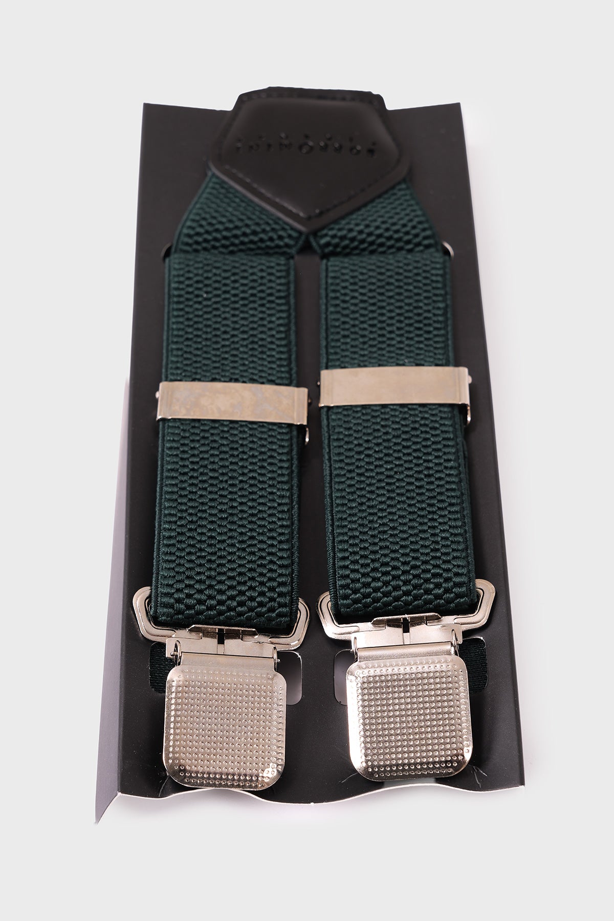 Front view of green braces with raised geometric pattern and metal clips