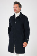 Front view of the navy blue coat with a shirt collar on a model