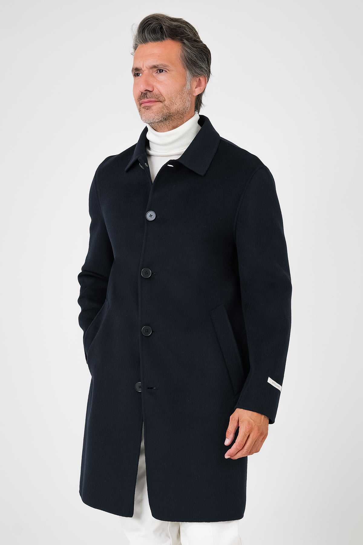 Front view of the navy blue coat with a shirt collar on a model