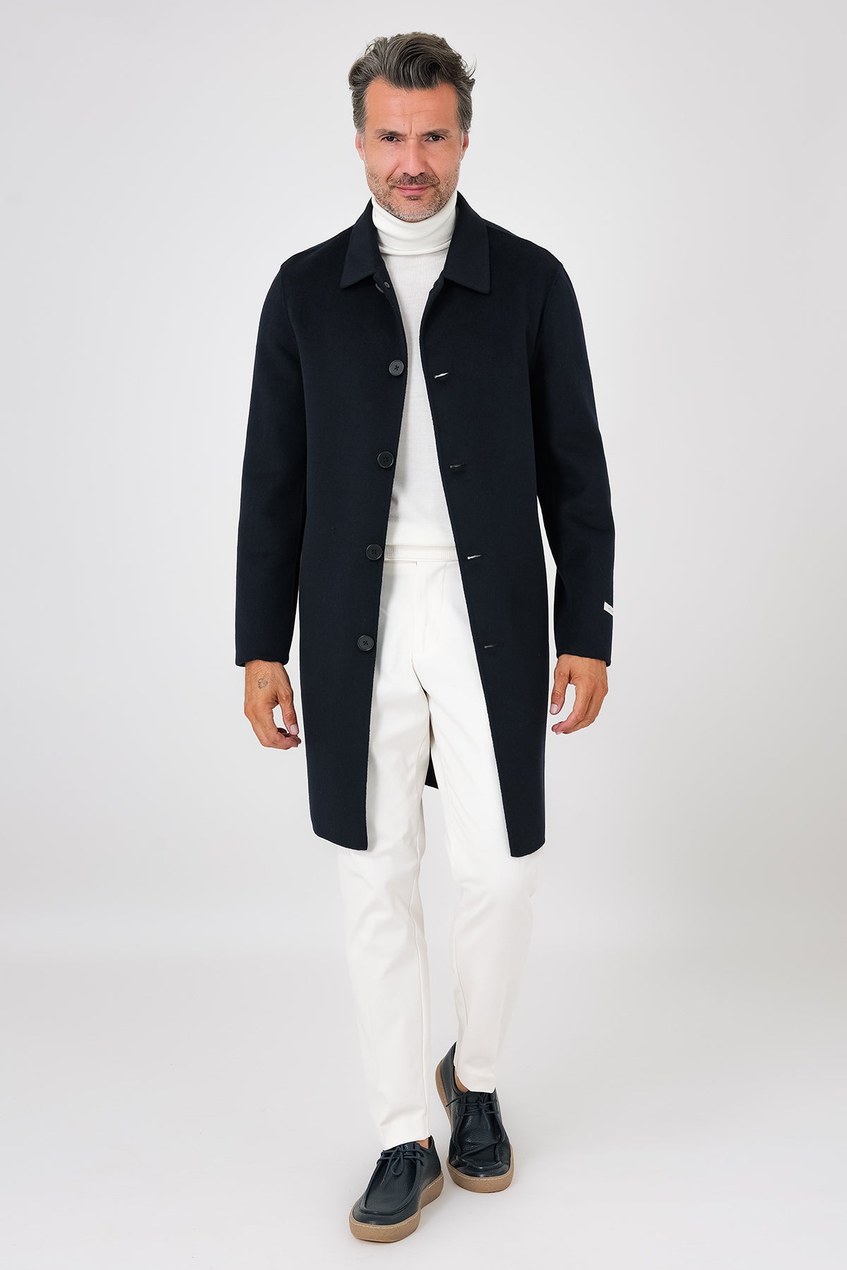 Navy blue double-faced coat with shirt collar on a model, front view