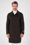 Front view of the dark brown coat with shirt collar and front buttons, on a model
