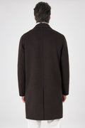Back view of the dark brown double-faced coat on a model, with central seam and vent