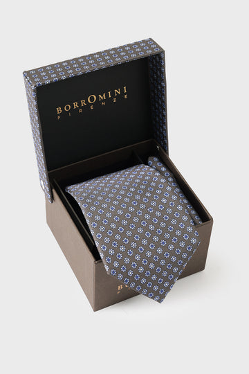 Multicoloured silk tie and pocket square set in an open box