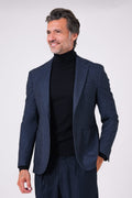 Front view of the blue jacket with patch pockets on a model