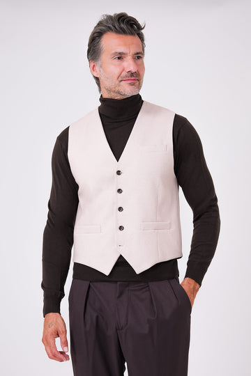 Front view of beige herringbone waistcoat on a model