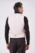 Rear view of beige herringbone waistcoat on a model, with an adjustable back strap