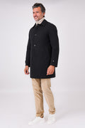 Black raincoat with a shirt collar and button fastening on a model
