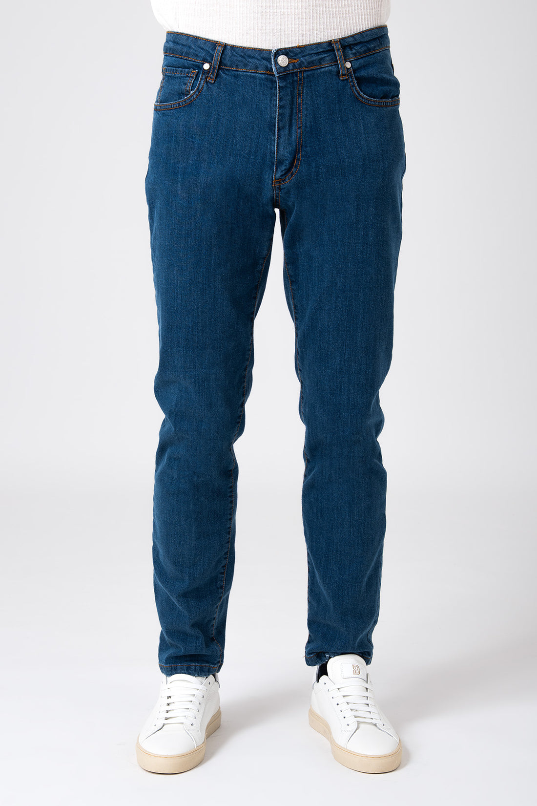 Man wearing dark denim five pocket jeans front view