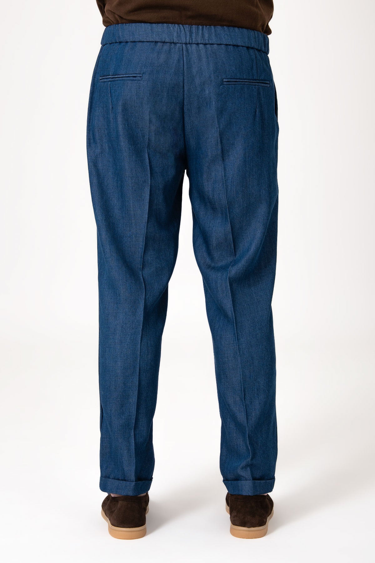 Man wearing dark denim jeans with lace and cuff detail back view