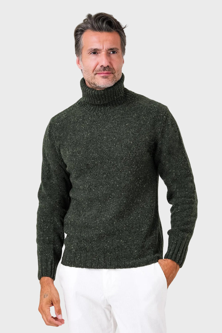 Front view of a green wool-blend roll-neck jumper with a ribbed neck on a model