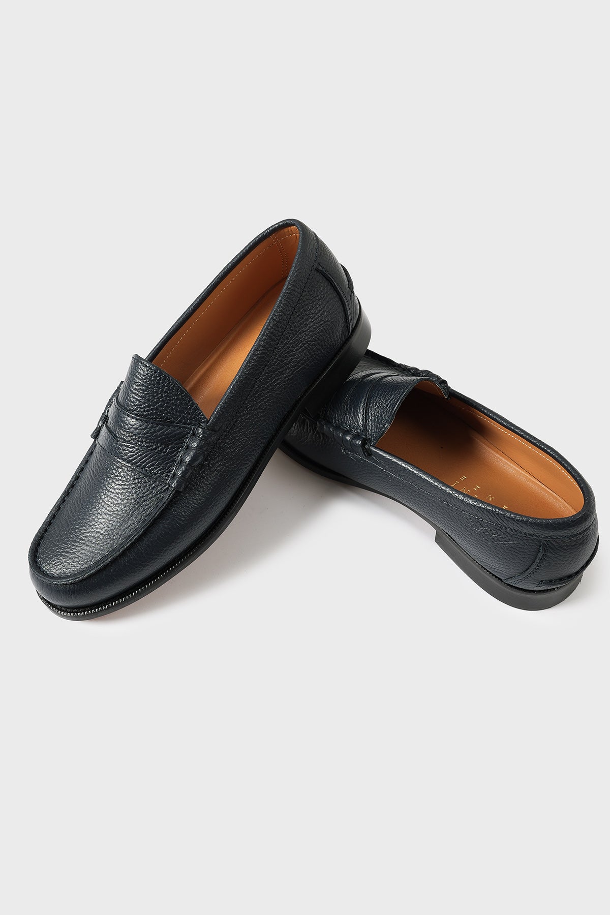 Pair of classic blue leather loafers with penny strap