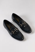 Patent leather penny loafers in blue, side view