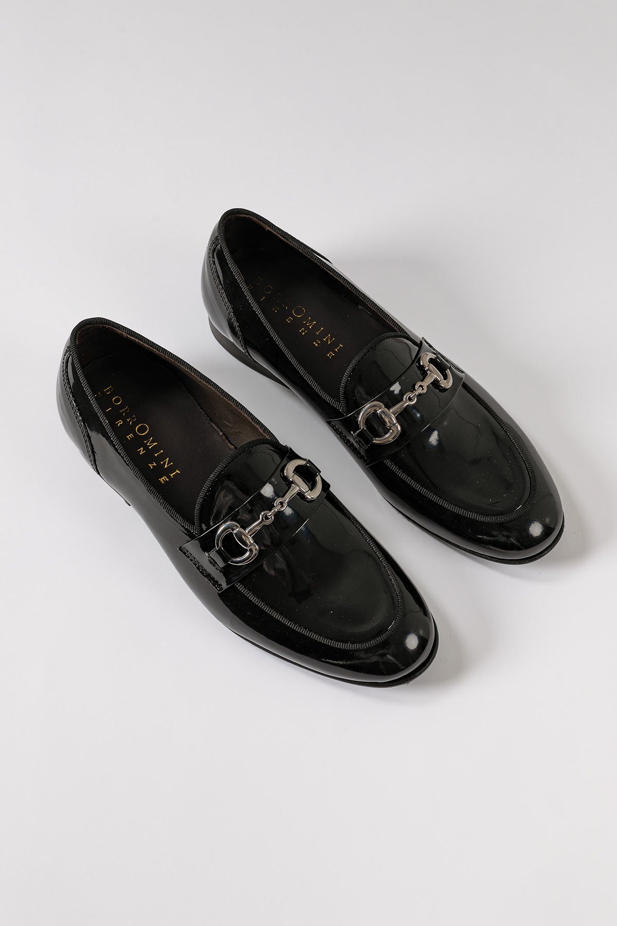 Patented leather penny loafers in black - side view