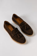 Rear view of blue suede loafers with tassels