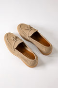 Front view of blue suede loafers with tassels