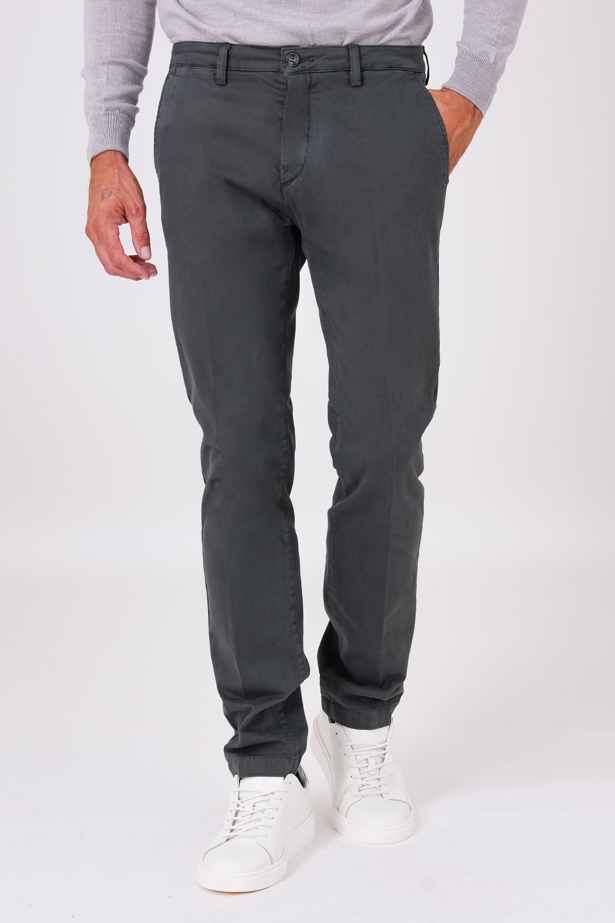 Front view of basic stretch cotton trousers in smoke grey on a model