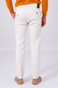 Rear view of cream stretch cotton trousers on a model