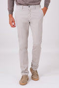 Front view of sand-coloured stretch cotton trousers on a model