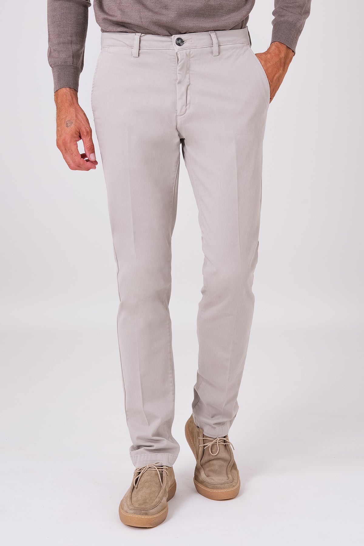 Front view of sand-coloured stretch cotton trousers on a model