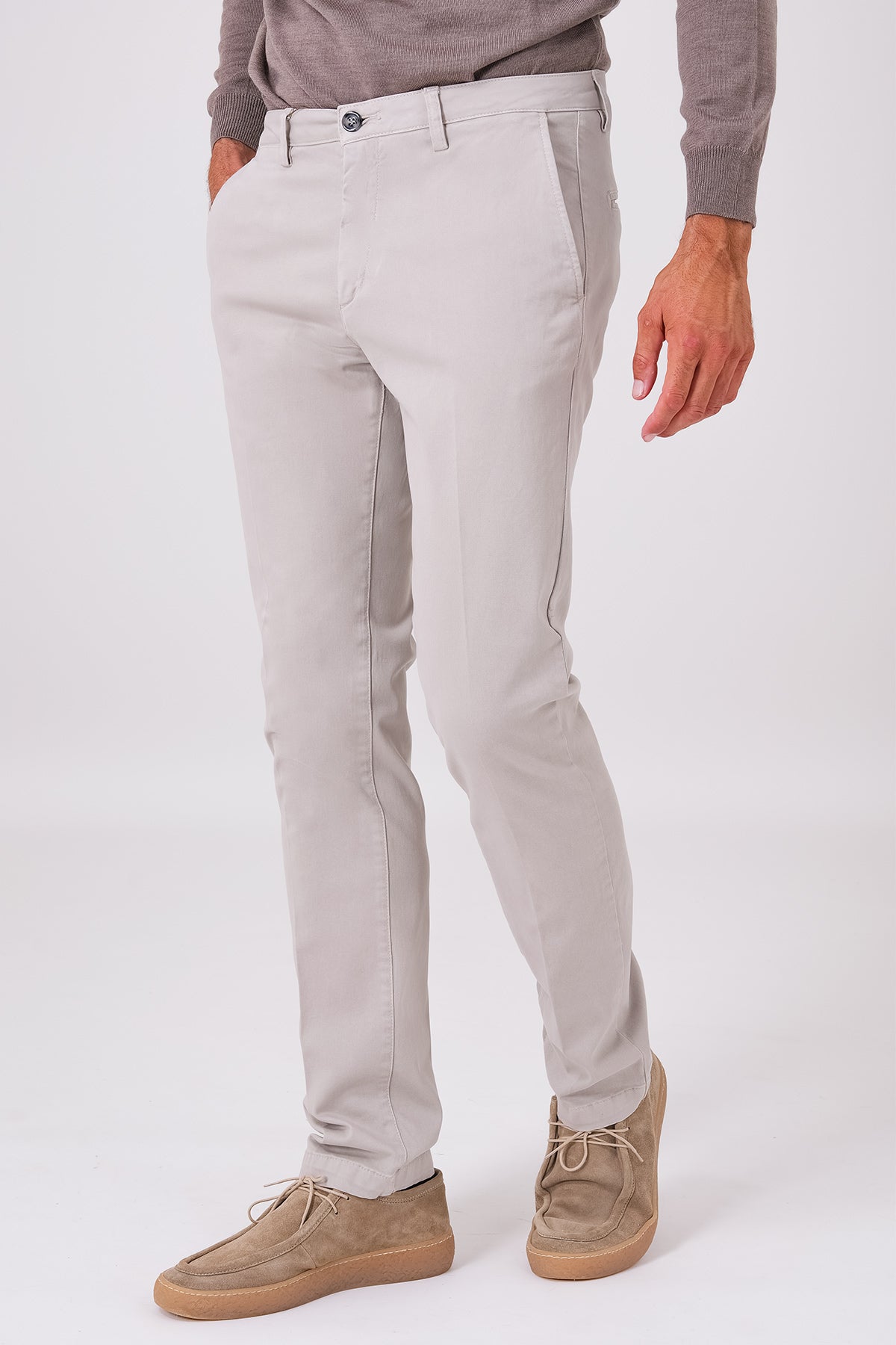 Sand-coloured basic stretch cotton trousers on a model, front view