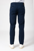 Man wearing blue cotton stretch pants back view