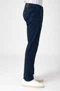 Side view of man wearing blue stretch cotton pants