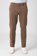Model wearing cotton stretch pants in earth tone, front view