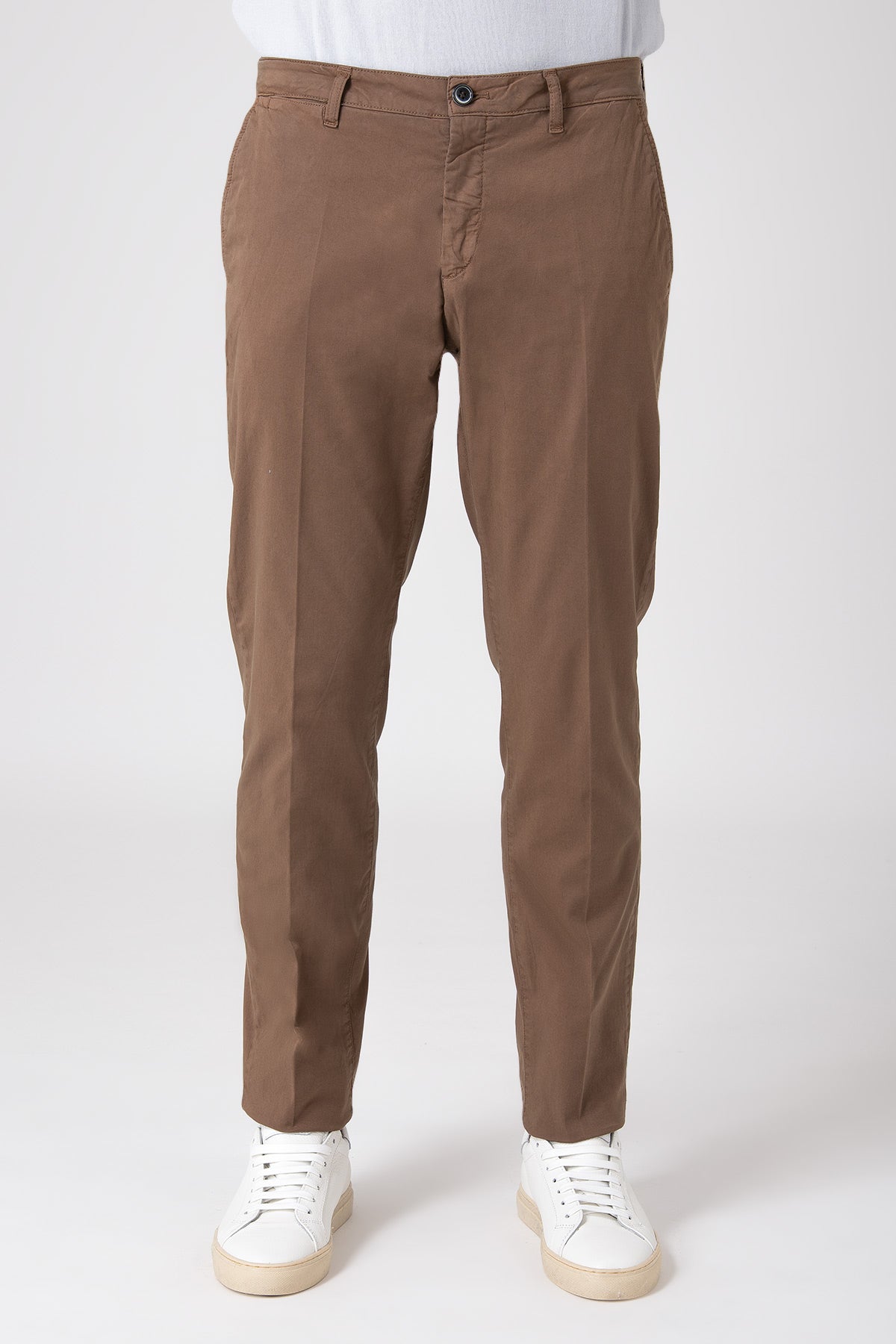 Model wearing cotton stretch pants in earth tone, front view
