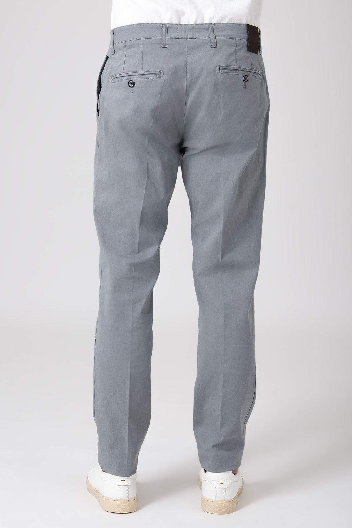Man wearing grey stretch cotton pants, back view
