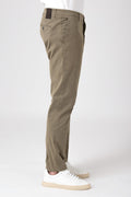 Side view of man wearing stretch cotton pants in mud color