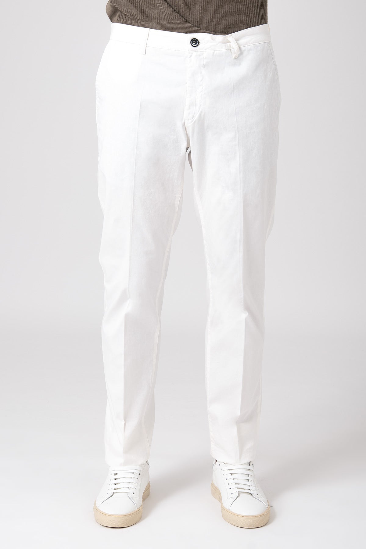Man wearing cream stretch cotton pants front view