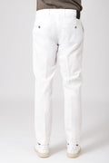 Man wearing cream stretch cotton pants rear view