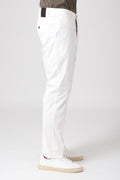 Man wearing cream stretch cotton pants side view